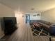 Living room featuring a large gray couch and a decorative rug at 1400 Jamielinn Ln # 102, Las Vegas, NV 89110