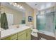 Updated bathroom with a modern vanity, a glass-enclosed shower, and wood-look floors at 1544 Tilman Ln, Boulder City, NV 89005