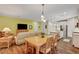 Bright dining area with wooden table and chairs near kitchen and living room at 1544 Tilman Ln, Boulder City, NV 89005