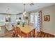 Charming dining area with wooden table and chairs, adjacent to the kitchen at 1544 Tilman Ln, Boulder City, NV 89005