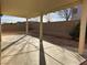 Spacious covered back patio featuring a concrete slab and brick perimeter at 161 Lenape Heights Ave, Las Vegas, NV 89148