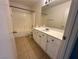 Bathroom featuring a shower-over-bath and vanity sink, combining practicality and style at 161 Lenape Heights Ave, Las Vegas, NV 89148