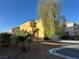 Two-story home with a desert landscaped front yard with tree at 161 Lenape Heights Ave, Las Vegas, NV 89148