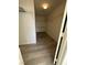 Spacious walk-in closet with wood floor and shelving, perfect for organization and storage at 161 Lenape Heights Ave, Las Vegas, NV 89148