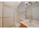 Clean bathroom with shower/tub combo and wood vanity at 1800 Edmond St # 252, Las Vegas, NV 89146