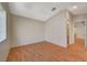 Bright bedroom with wood-look flooring and a large window at 1800 Edmond St # 252, Las Vegas, NV 89146