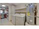 Bright laundry room, washer, dryer, and kitchen view at 1800 Edmond St # 252, Las Vegas, NV 89146