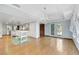 Open concept dining room and kitchen with hardwood floors and island at 1808 Birch St, Las Vegas, NV 89102