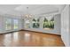 Bright dining room with hardwood floors, chandelier, and access to the pool at 1808 Birch St, Las Vegas, NV 89102