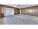 Large living room featuring wood paneling and ceiling fan at 1808 Birch St, Las Vegas, NV 89102