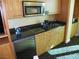 Efficient kitchenette equipped with modern appliances and storage at 2000 N Fashion Show Dr # 2305, Las Vegas, NV 89109