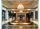 Elegant lobby featuring marble floors, ornate chandeliers, and lush greenery at 2000 N Fashion Show Dr # 2305, Las Vegas, NV 89109