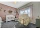 Bedroom decorated with pink accents, a crib, and a tent at 2124 Pont National Dr, Henderson, NV 89044