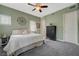 Comfortable bedroom featuring a ceiling fan, carpet, and natural light at 2124 Pont National Dr, Henderson, NV 89044