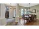 Dining area boasting wood floors, natural light, chandelier, and ornate trim at 2124 Pont National Dr, Henderson, NV 89044