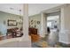 Elegant dining room with a chandelier, wood floors, and access to the living room at 2124 Pont National Dr, Henderson, NV 89044