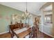 Dining area with hardwood floors, a chandelier, and a decorative buffet at 2124 Pont National Dr, Henderson, NV 89044