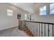 Hallway with wooden railing and views of the outside at 2124 Pont National Dr, Henderson, NV 89044