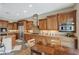 Spacious kitchen with granite countertops, custom cabinets, and stainless steel appliances at 2124 Pont National Dr, Henderson, NV 89044