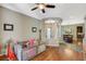 Open living area with columns, tile flooring, and views into the dining room at 2124 Pont National Dr, Henderson, NV 89044