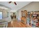 Inviting living area featuring tile floors, hardwood floors, and built in shelving at 2124 Pont National Dr, Henderson, NV 89044