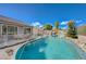 Inviting pool with rock waterfall and slide features for backyard fun at 2124 Pont National Dr, Henderson, NV 89044