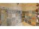 Tiled shower stall with bench and stone accents at 2124 Pont National Dr, Henderson, NV 89044