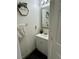 Small bathroom with sink, mirror, and towel at 2130 Trebbiano Way, Las Vegas, NV 89156