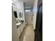 Clean bathroom with shower, vanity, and neutral tile flooring at 2130 Trebbiano Way, Las Vegas, NV 89156