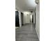 Bright hallway with gray flooring and access to multiple rooms at 2130 Trebbiano Way, Las Vegas, NV 89156