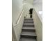 Modern gray stairs leading to the upper level at 2130 Trebbiano Way, Las Vegas, NV 89156