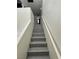 Modern gray stairs with white walls at 2130 Trebbiano Way, Las Vegas, NV 89156