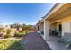 Beautiful backyard with desert landscaping and an expansive covered patio at 2192 Tiger Links Dr, Henderson, NV 89012