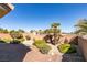 Private backyard featuring low-maintenance desert landscaping and privacy wall at 2192 Tiger Links Dr, Henderson, NV 89012