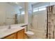 Cozy bathroom featuring a shower-tub combo and a large mirror at 2192 Tiger Links Dr, Henderson, NV 89012