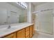 Well-lit bathroom with a shower and a large mirror at 2192 Tiger Links Dr, Henderson, NV 89012