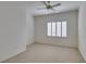 Bedroom featuring a ceiling fan and window with bright natural light at 2192 Tiger Links Dr, Henderson, NV 89012