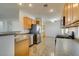 Spacious kitchen featuring stainless steel appliances and tile flooring at 2192 Tiger Links Dr, Henderson, NV 89012