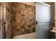 Close-up of remodeled bathroom shower with decorative tile surround and glass doors at 2244 Brighton Shore St, Las Vegas, NV 89128