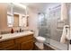 Bathroom featuring sink with dark hardware and a shower with glass doors at 2244 Brighton Shore St, Las Vegas, NV 89128