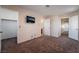 Comfortable carpeted bedroom with easy access to ensuite bathroom and closet at 2244 Brighton Shore St, Las Vegas, NV 89128