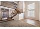 Inviting foyer featuring high ceilings, a staircase, and large windows for natural light at 2244 Brighton Shore St, Las Vegas, NV 89128