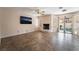 Living room with tile floors, a fireplace, and sliding glass doors that open to the backyard pool at 2244 Brighton Shore St, Las Vegas, NV 89128