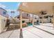 Covered patio overlooking rectangular pool, spa, and landscaped backyard at 2244 Brighton Shore St, Las Vegas, NV 89128