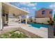 Backyard with rectangular pool, covered patio, and desert landscaping at 2244 Brighton Shore St, Las Vegas, NV 89128