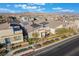 An aerial view of a modern home with desert landscaping, contemporary architecture, and an open concept design at 2498 Veronella St, Henderson, NV 89044