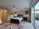 Bedroom with sleek furniture, modern rug, and large view to the exterior at 2498 Veronella St, Henderson, NV 89044