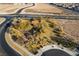 Aerial view of a well-maintained community amenity with trees, green spaces, and walking paths at 2498 Veronella St, Henderson, NV 89044