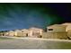 Street view of new construction homes with dark garage doors, landscape blocks and desert landscaping at 2498 Veronella St, Henderson, NV 89044