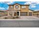 Charming two-story home with a three-car garage and beautiful desert landscaping at 2593 Indigo Cloud Ct, Las Vegas, NV 89142